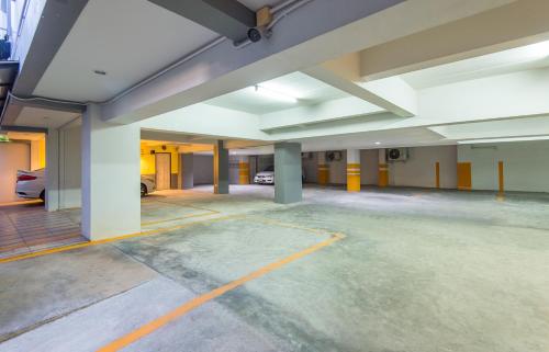 an empty parking lot in a parking garage at Sleep Whale Hotel in Krabi town