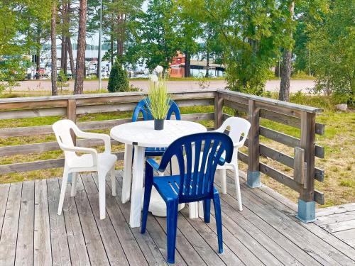 a table and chairs on a wooden deck at 6 person holiday home in Mönsterås-By Traum in Mönsterås