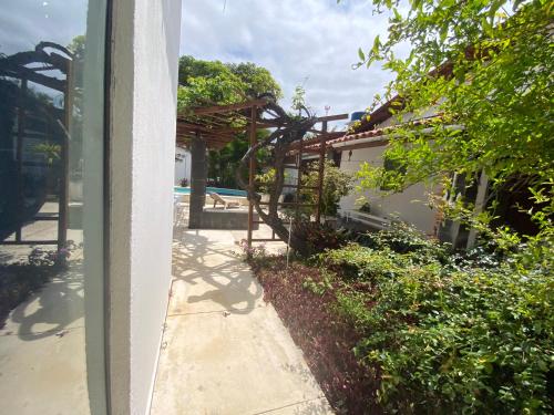 a view of a house with a patio and a pool at Casa Beira Mar Itamaracá in Itamaracá