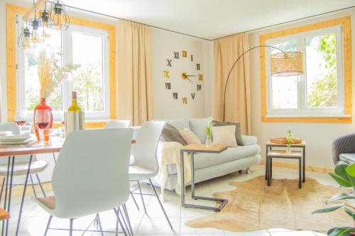 a living room with a couch and a table at Wellnessoase mitten in der Wasserfallstadt Triberg in Triberg