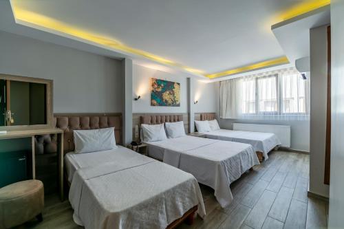 En eller flere senge i et værelse på Gul Otel