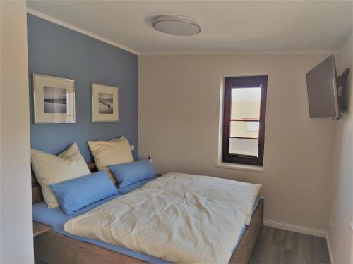 Postel nebo postele na pokoji v ubytování Kleine-Ostseeliebe 2