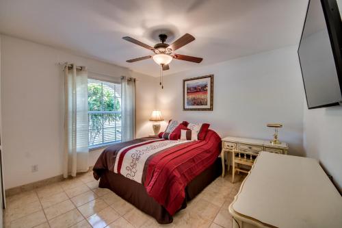a bedroom with a bed and a ceiling fan at Villa Sweet Dreams, Cape Coral in Cape Coral
