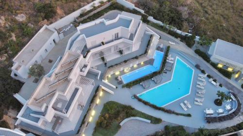 an aerial view of a house with a swimming pool at Relux Ios Hotel in Ios Chora