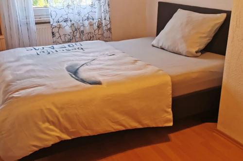 a bed with a whale painted on the side of it at Maison Room in Karlsruhe