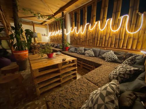 a living room with a couch and a table at Huitzilin Hostal in Brisas de Zicatela