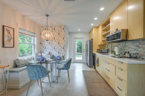 a kitchen with a table and chairs in a room at Sunny Florida Escape with Patio, Grill and Fire Pit! in Naples