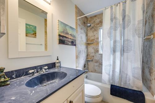 a bathroom with a sink and a toilet at Sunny Florida Escape with Patio, Grill and Fire Pit! in Naples