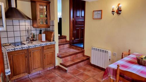 a kitchen with a sink and a stairway at Los Nacientes: Cordero in Los Sauces