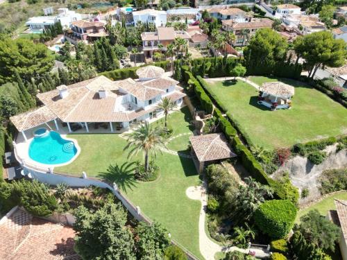 an aerial view of a house with a swimming pool at Colina del Mar in Benalmádena