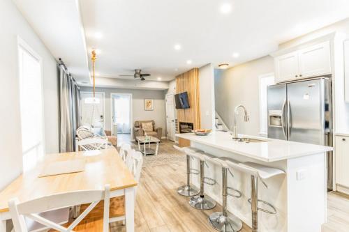 a kitchen and living room with a table and chairs at Next to Convention Center, Dave and Busters and Shops with parking in Atlantic City