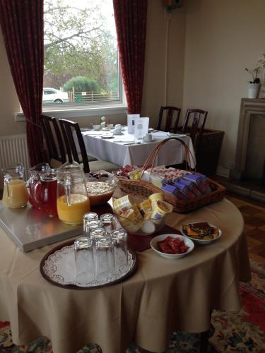 a table with food and drinks on top of it at Poolewe Hotel in Poolewe