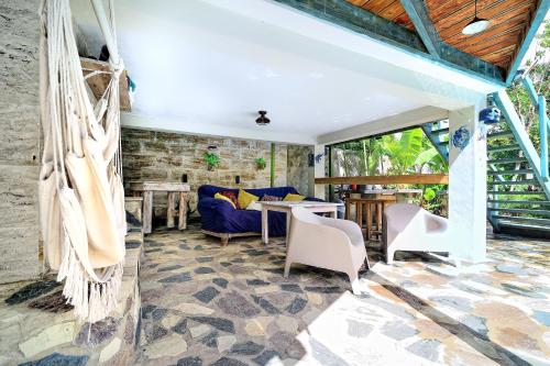 a living room with a table and chairs at Cabarete Boutique Kite Hotel for up to 15 people in Cabarete