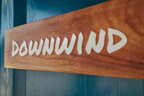a wooden sign on a wall with the word drupal at Panama Kite Center in Punta Chame