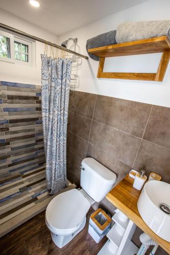 a bathroom with a toilet and a sink at Panama Kite Center in Punta Chame