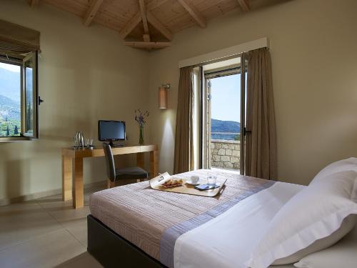 Postel nebo postele na pokoji v ubytování Anaxo Resort