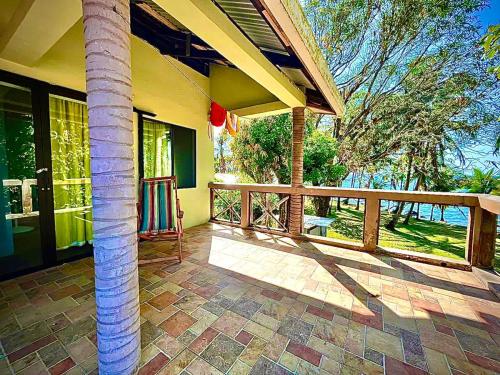 a porch of a house with a column at Coral View Hostel in Corn Island