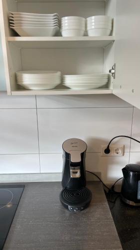 a coffee maker sitting on a counter in a kitchen at Apartment am Zollverein -WiFi - Parking for free in Essen