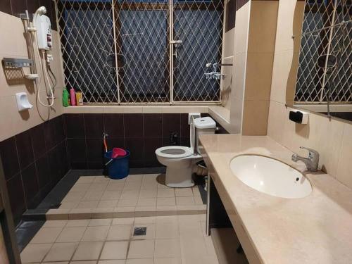 a small bathroom with a sink and a toilet at Home in Gelugor4R3B Dnaz Homestay@Sg. Dua in Gelugor