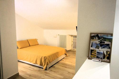 a bedroom with a bed and a room with boxes at In Monferrato da Valentina in Calliano
