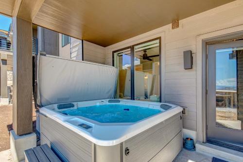 a jacuzzi tub on the side of a house at On Top of the Mountains - Full Townhome in Keetley