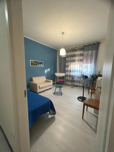 a living room with a bed and a couch in a room at CASA VACANZA BELVEDERE in Ercolano