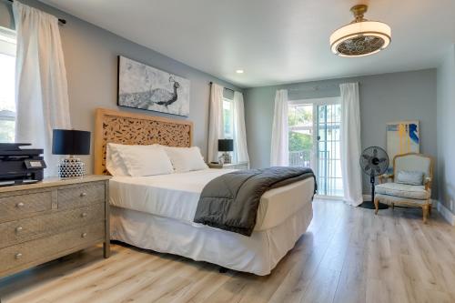 a bedroom with a bed and a dresser with a television at Family Home with Pool about 7 Mi to Downtown Sacramento! in Sacramento