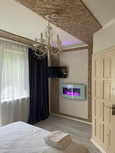 TV a/nebo společenská místnost v ubytování Hotel Tys