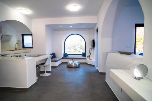 a bathroom with a sink and a large window at Shape-Meander in Kalymnos
