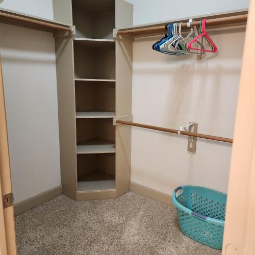 a walk in closet with a basket in it at Domain at Kirby in Houston