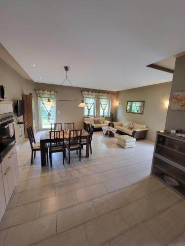 a kitchen and living room with a table and chairs at Ahr-Weinbergblick in Bad Neuenahr-Ahrweiler