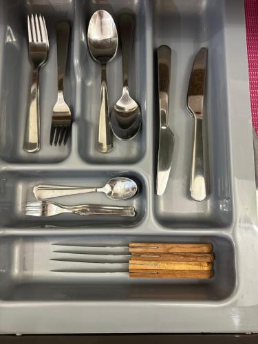 a tray of utensils in a sink at MiraSierraHome... Tú hogar de vacaciones! in Alora