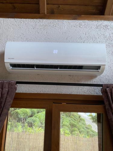 a air conditioner above a window in a room at Lavinya Suit Bungalov in Rize