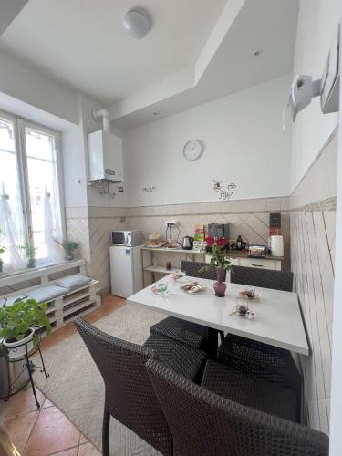 a kitchen with a table and chairs in a room at Suitedream Vatican in Rome