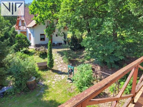 an aerial view of a yard with a house at Szarvas Panzió in Erdőbénye