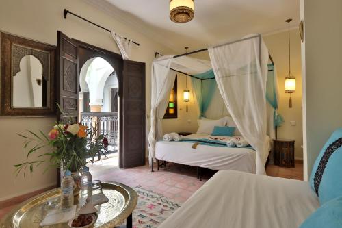 Postel nebo postele na pokoji v ubytování Riad 22 - L'Etoile d'Orient