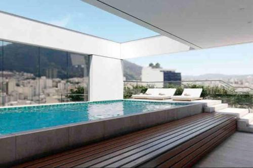 a swimming pool on top of a building at AP822 ar condicionado piscina academia coworking etc in Juiz de Fora