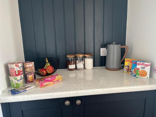 a counter with food and snacks on top of it at Sgothan Dearg in Portree