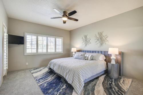 a bedroom with a bed and a ceiling fan at Beautiful Palm Desert Townhome with Community Perks! in Palm Desert