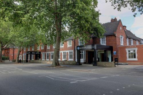 an empty street in front of a brick building at The Stuart Hotel, Sure Hotel Collection by Best Western in Derby