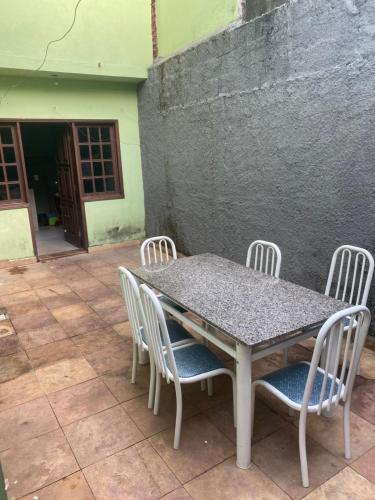 a table and chairs sitting on a patio at Pousada Gama in Diamantina
