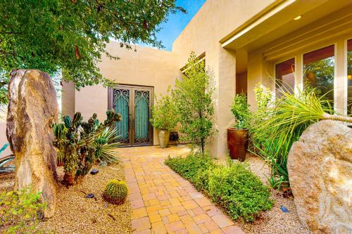 a house with a brick walkway in front of a building at East Horizon Sanctuary in Cave Creek