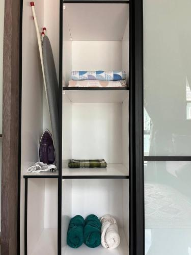 a glass cabinet with green items in it at Tambun Hillview Cottage 2 in Ipoh