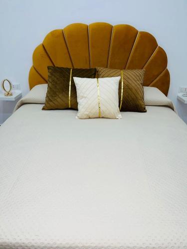 a bedroom with a large bed with a large headboard at Alex mary home in Naples