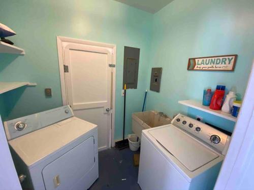 a laundry room with a washing machine and a washer at BEACH FRONT Luxury Home + Direct Beach Access in Ocean City