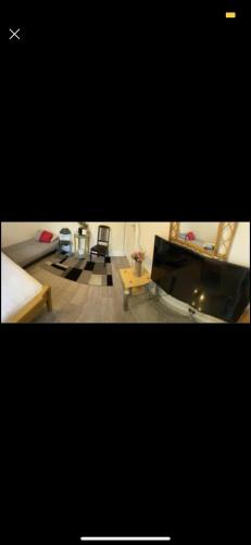 two pictures of a living room with a couch and a table at Home2home in Hendon