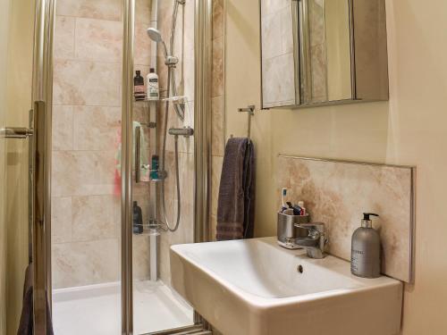 a bathroom with a sink and a shower at Wellgate in Middlesmoor