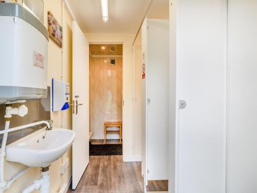 a bathroom with a sink and a toilet at Milo - Uk45070 in Llandybie
