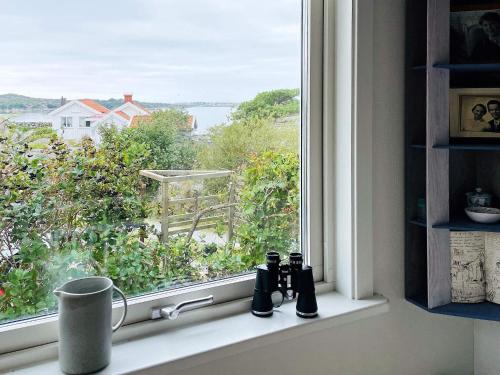 a window with a view of the water at 4 star holiday home in ELLÖS-By Traum in Ellös