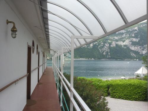 a balcony of a building with a view of the water at Hotel Nautilus in Valmadrera